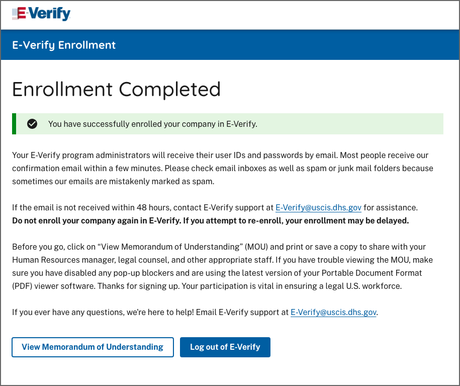 Screen capture showing E-Verify Enrollment Completed with Alert Banner reading "You have successfully enrolled your company in E-Verify."